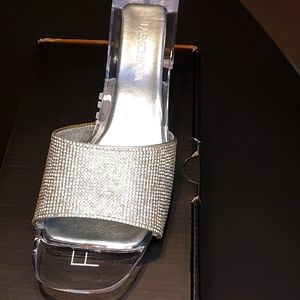 This is a brand new pair of lumens 02 silver size 7